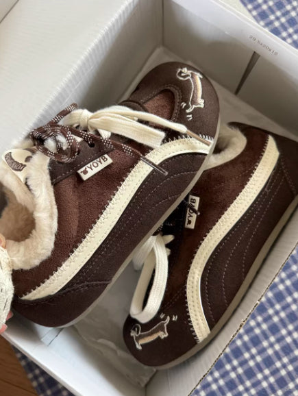 Brown Dachshund Wearing Plush Trainers
