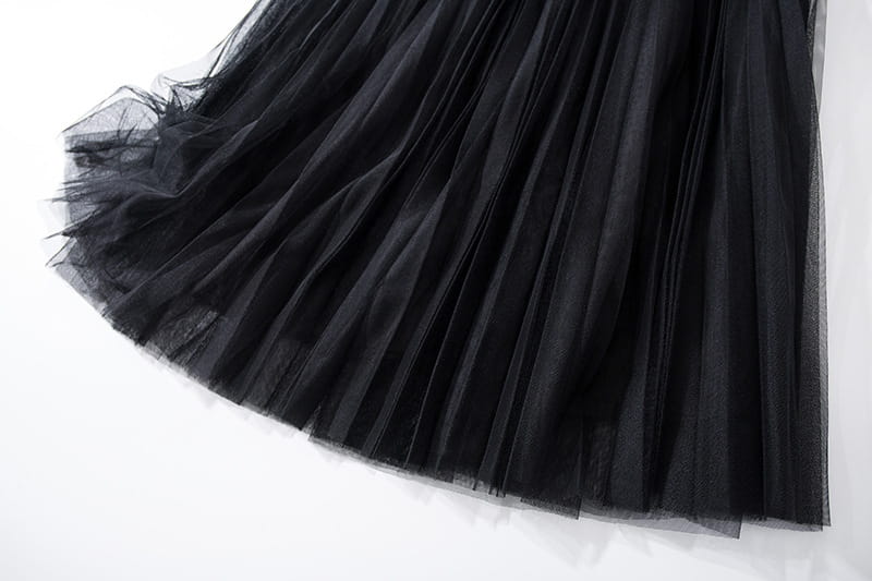 Black pleated tulle skirt from New Women’s Belts, showcasing a thin and elegant design.