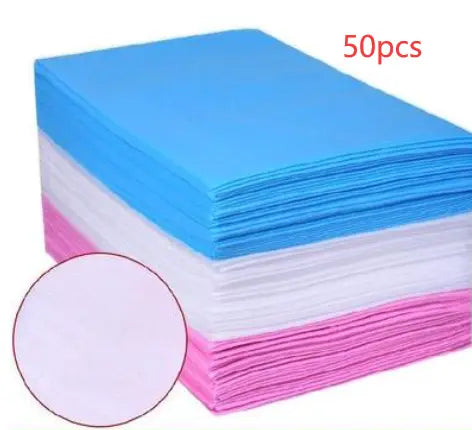 Stack of colorful disposable sheets for Physical Therapy bed use.