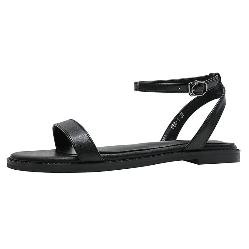 Un Mot Avec Des Sandales Plates Chaussures