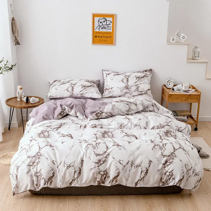 Marble-patterned bedding set including duvet cover and pillowcases for elegant styling.