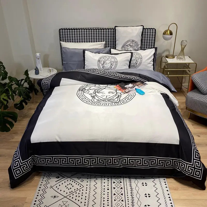 Black and white Versace-themed bedding set featuring Silk Four-piece Silky Sheets.