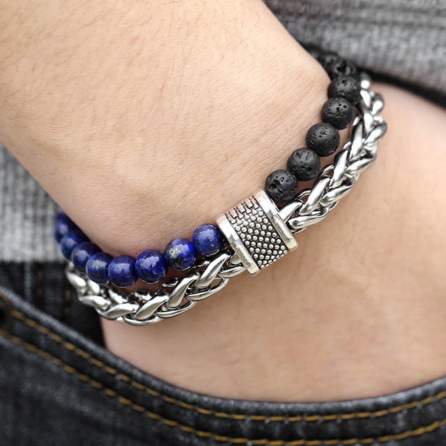 Layered beaded and chain bracelets for men and women, perfect for stylish accessory choices.
