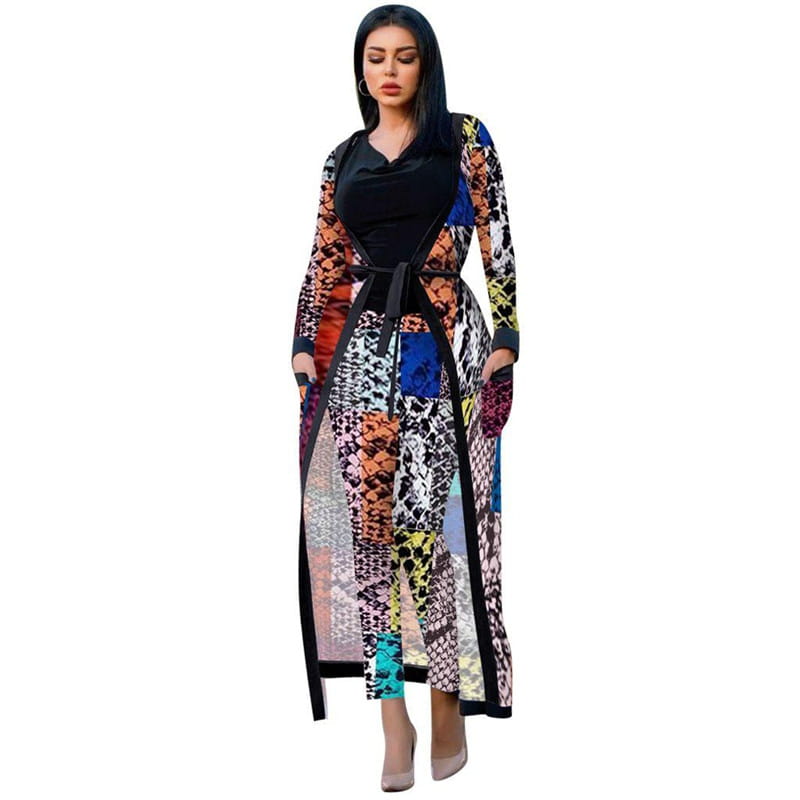 Woman in colorful patchwork outfit showcasing Women’s Two-piece Suit with pockets and belts.