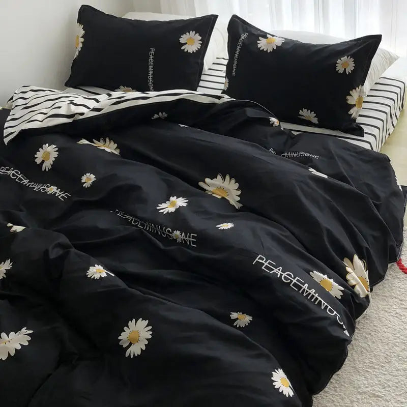 Black daisy-patterned bedding set for single bed in student dormitory room decor.