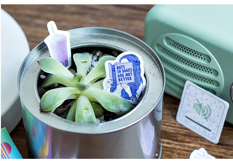 Succulent in a metallic pot adorned with stickers from Sticker Sticker 46 Sheets.