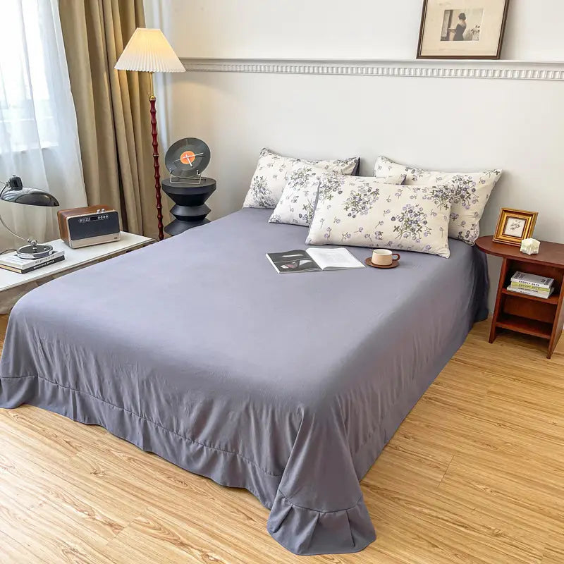 Gray ruffled bedspread in Four-piece Bed Set Jacquard Quilt Cover Sheets collection.