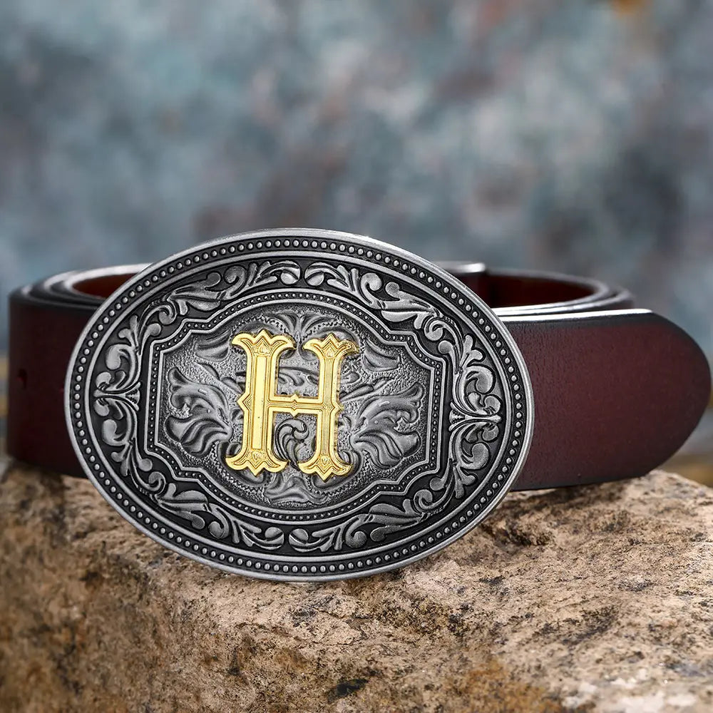 Ornate gold ’H’ belt buckle on a floral letter buckle belt for men and women.