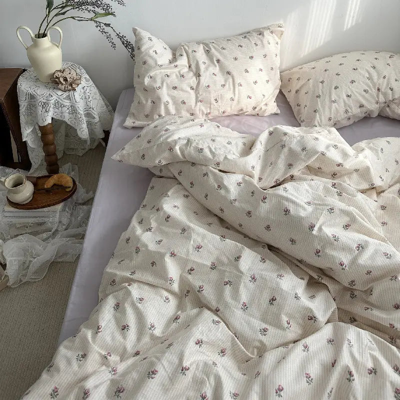 Floral patterned bedding in a Cotton Bed Four Piece Set of Sheets and Duvet Covers.