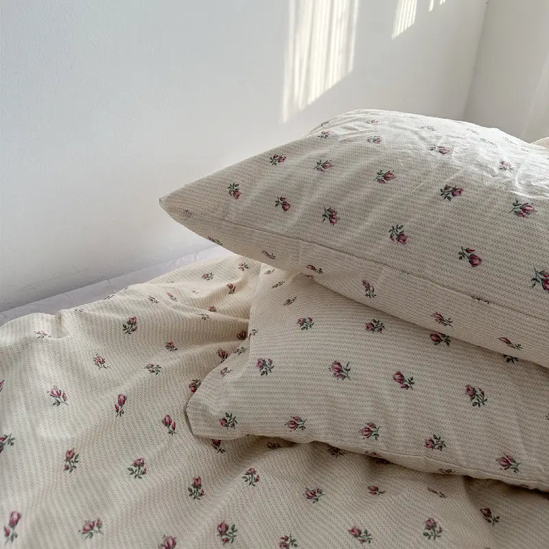 Floral patterned bedding from Cotton Bed Four Piece Set of Sheets and Duvet Covers.