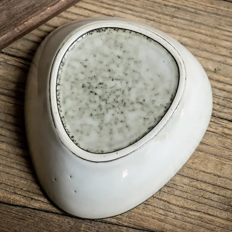 White ceramic dish in Retro Irregular Flaw Salad Plates showcasing unique design.
