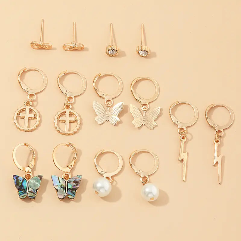 Assorted gold-tone earrings from the Multi-Element Lightning Cross Small Earring Set.