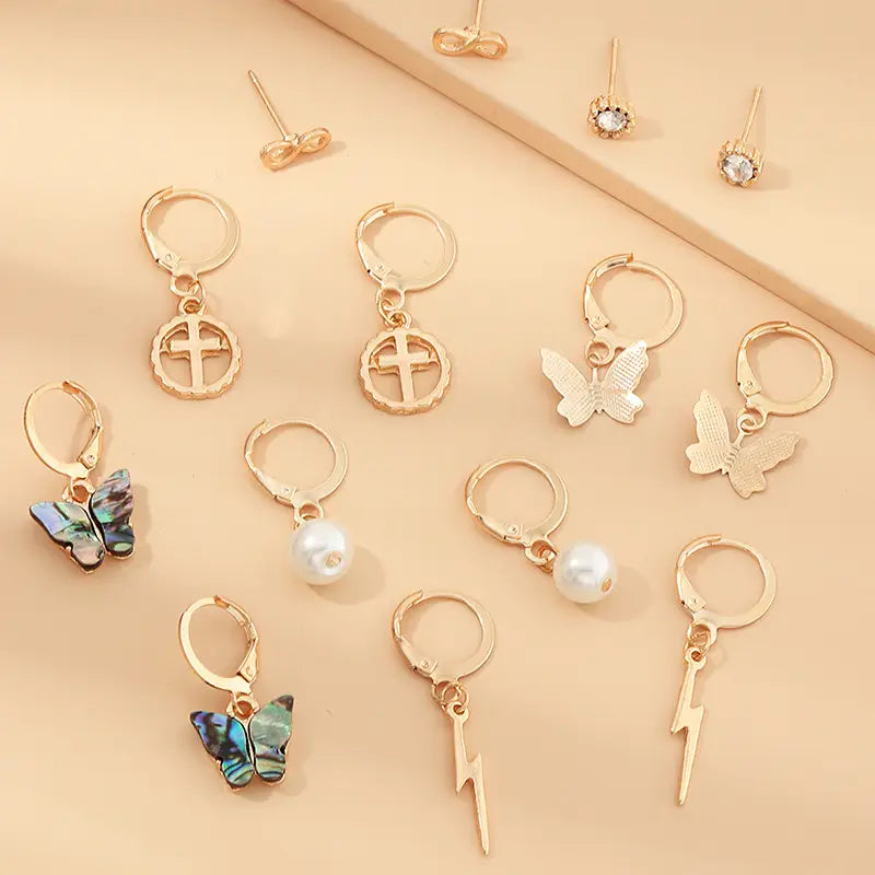 Assorted gold-tone earrings from Multi-Element Lightning Cross Small Earring Set.