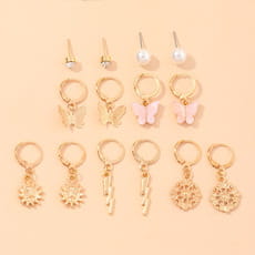 Assorted gold-tone earrings in Multi-Element Lightning Cross Small Earring Set.