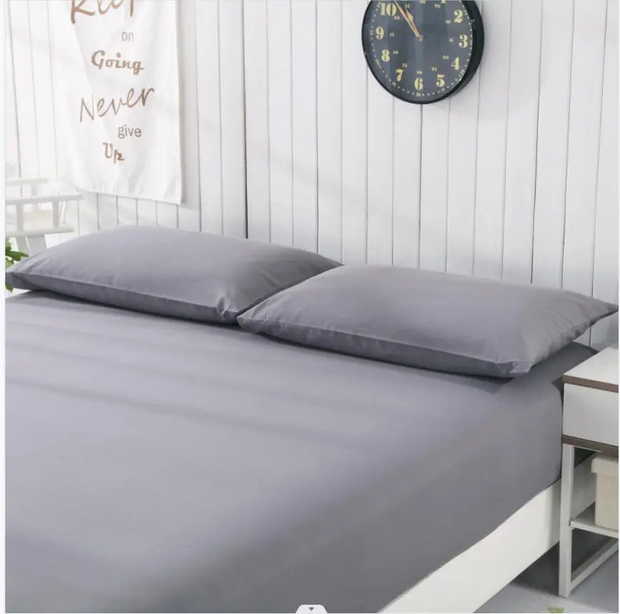 Gray bedsheets and pillows from Flat Bed Sheets Are Grounded For Natural Health collection.
