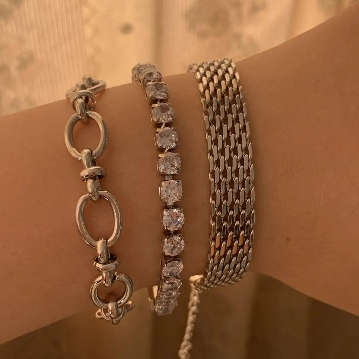 Three silver bracelets from the Retro Set featuring crystal heart designs and adjustable styles.