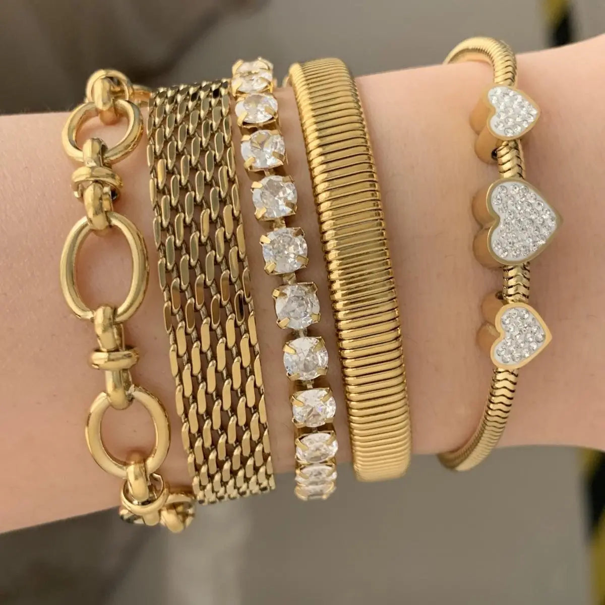 Gold bracelets featuring diverse designs from the Retro Set Silver Crystal Heart Shaped Jewelry.