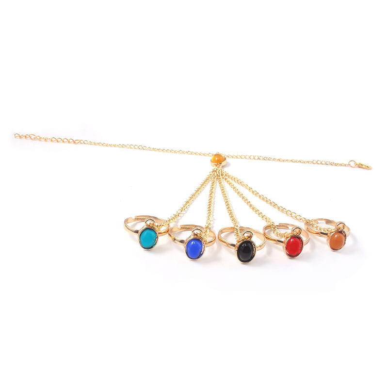 Gold-tone hand chain featuring colorful gemstone rings in women’s bracelets collection.