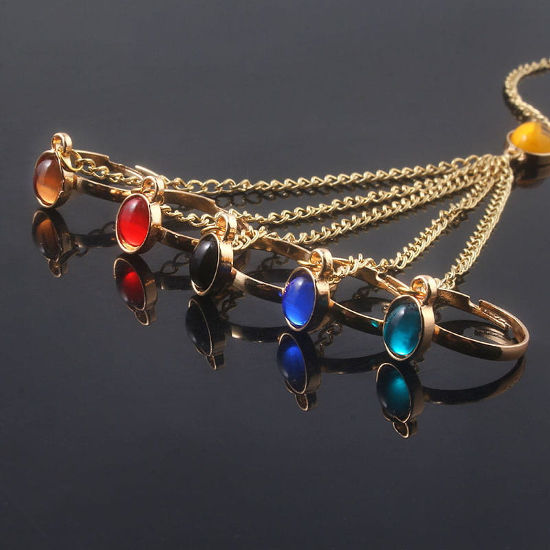 Gold-tone hand chain adorned with colorful stones in women’s bracelet collection.