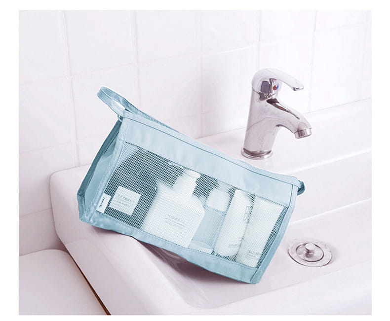 Blue mesh toiletry bag from 8-piece Set Luggage Divider Bag Travel Storage Organizer.