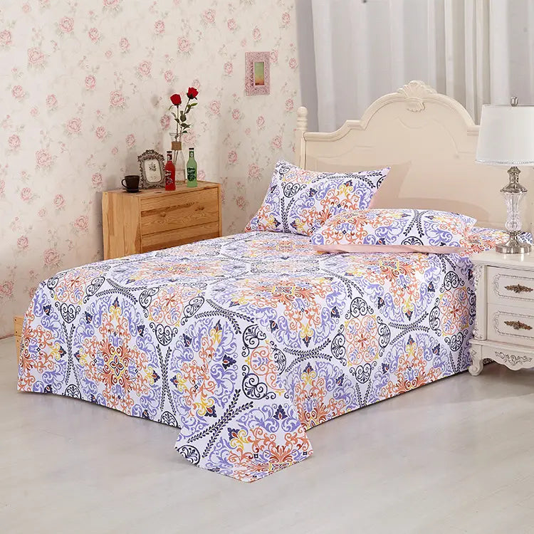 Patterned bedspread with matching pillows from Reactive Printed Cotton Sheets collection.