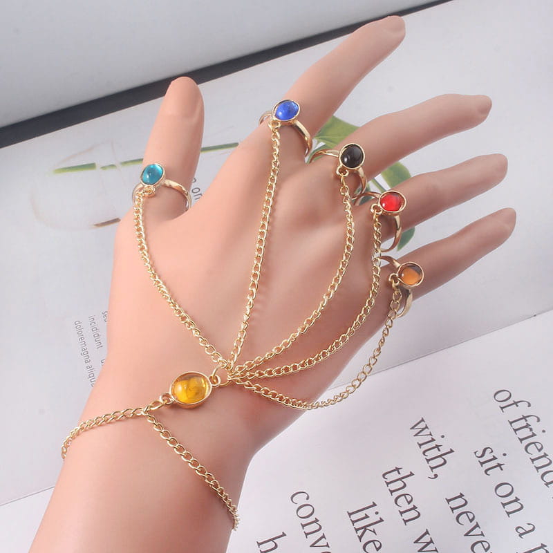Gold-tone hand chain featuring colorful gemstone rings for women and girls jewelry.