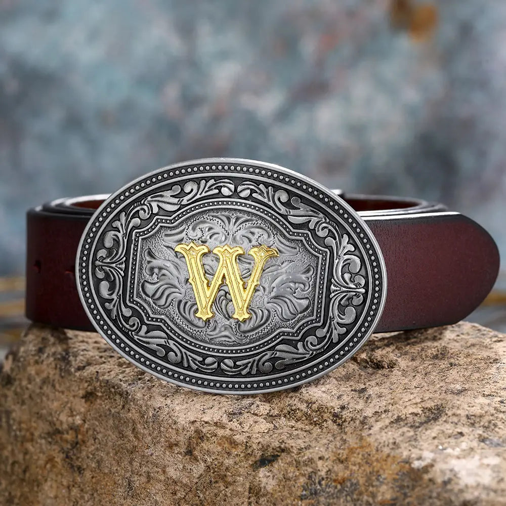 Brown leather belt featuring a floral silver and gold ’W’ buckle for unisex style.