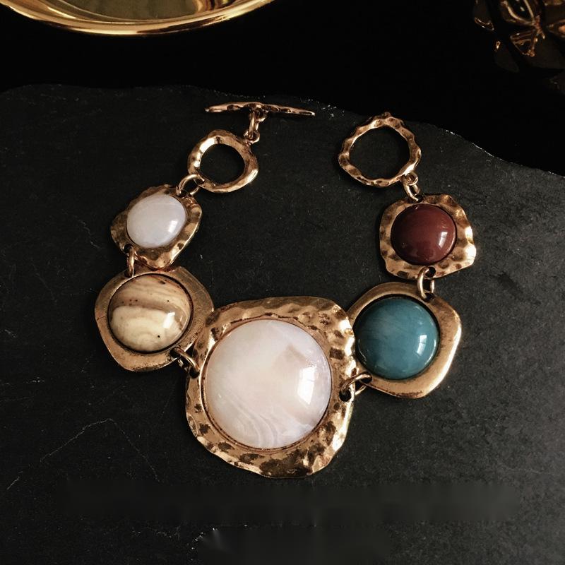 Gold-toned Retro bracelets for couples featuring vibrant stone accents for men and women.
