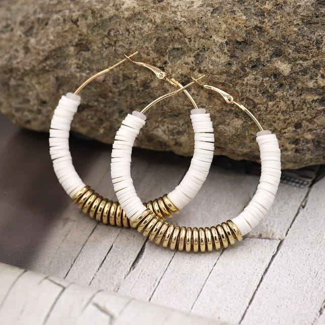Hoop earrings adorned with white and gold beads for women’s classic jewelry collection.
