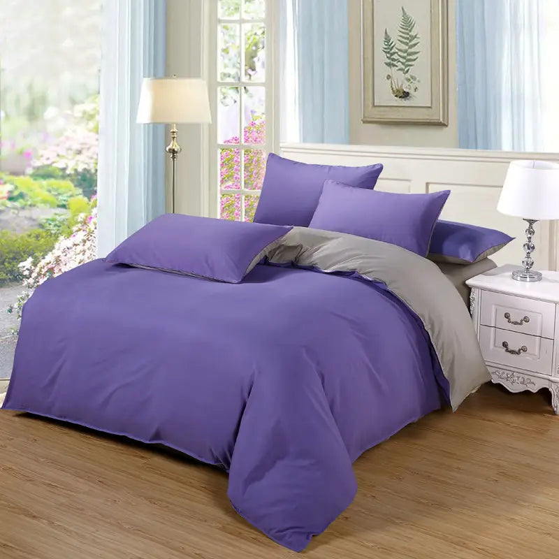 Purple and gray bedding set featuring a quilt duvet cover in a stylish design.