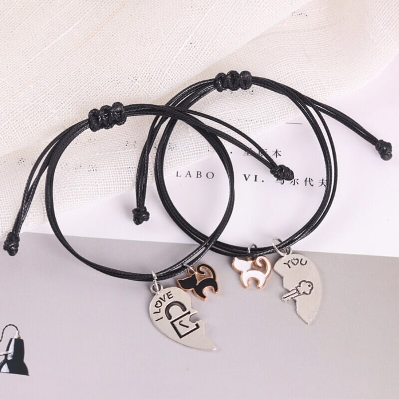 Matching couple bracelets with heart pendants for men and women in stylish design.