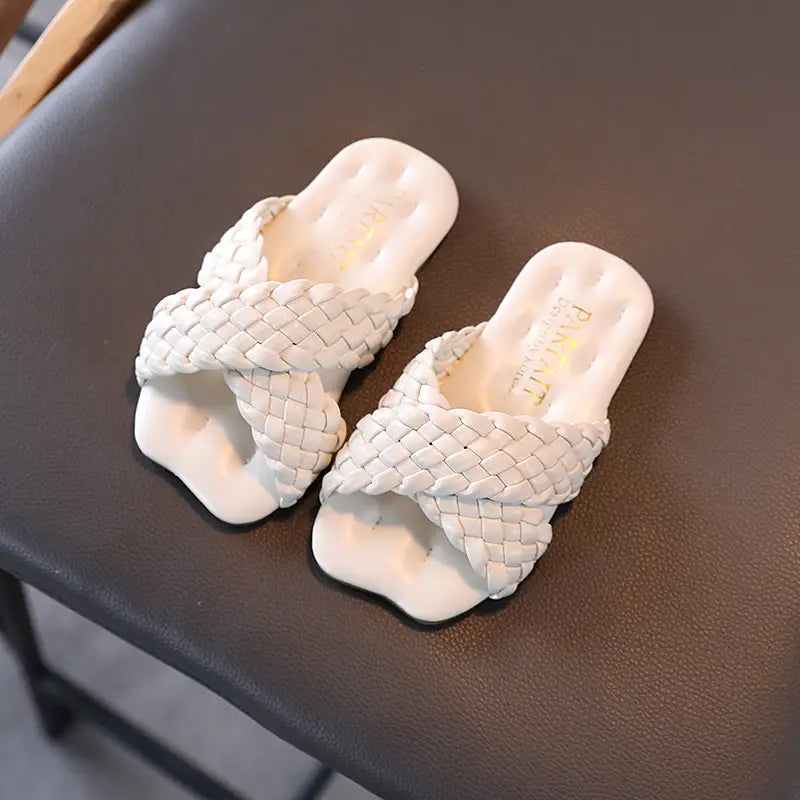 Little Girls Wear Children’s Sandals With Soft Soles Outside Their Homes