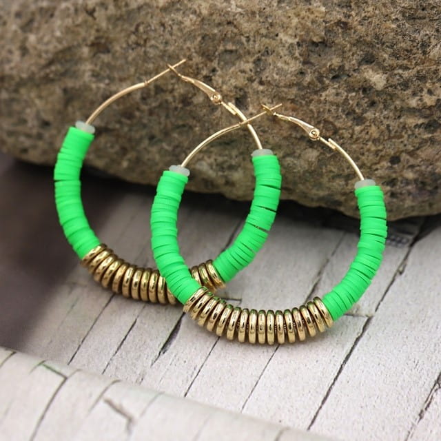 Hoop earrings featuring green and gold beads in a classic silver design for women.