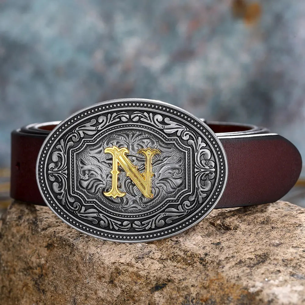 Brown leather belt featuring a silver and gold ’N’ buckle for stylish unisex fashion.