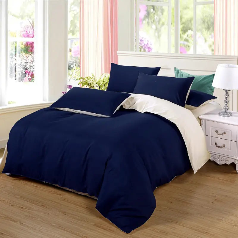 Navy blue bedding set featuring quilt duvet cover and four coordinating pieces.