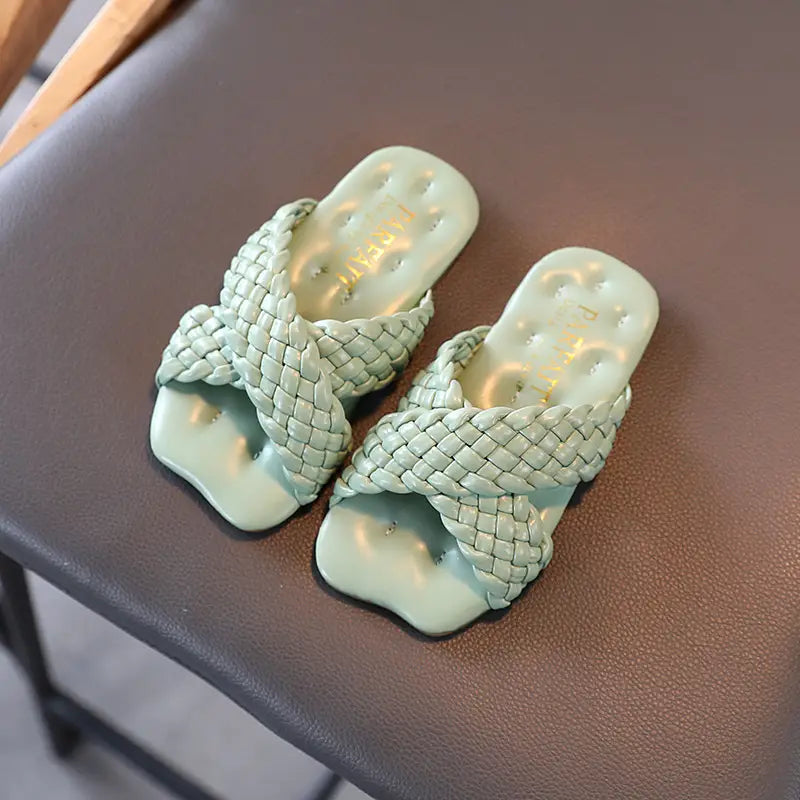 Little Girls Wear Children’s Sandals With Soft Soles Outside Their Homes