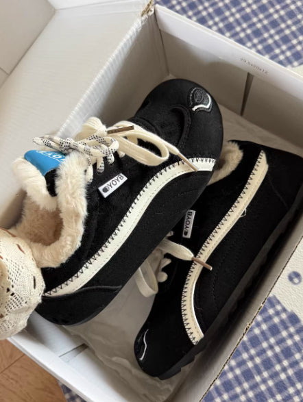 Brown Dachshund Wearing Plush Trainers