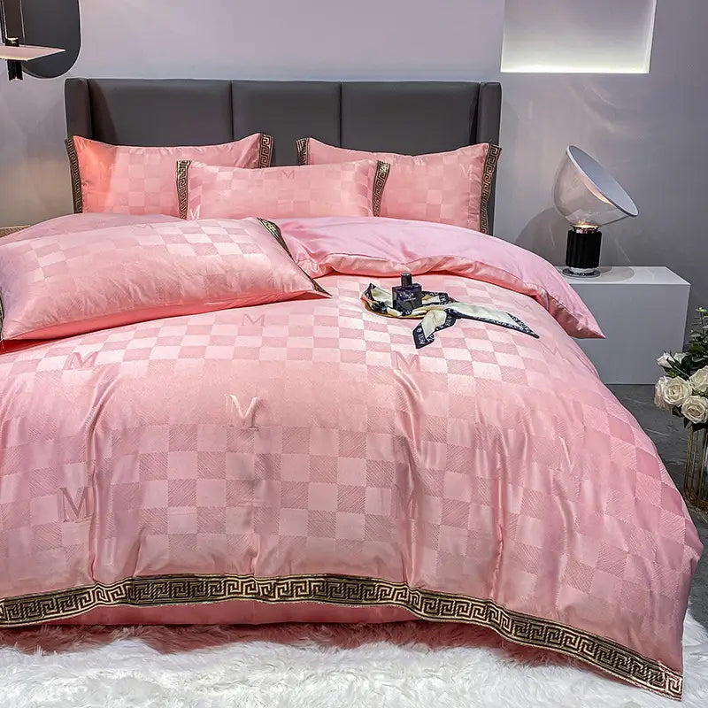 Pink checkered bedding set featuring Silk Cotton Sheets and a quilt cover for beds.