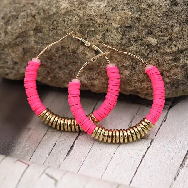 Pink and gold hoop earrings from Earrings Jewelry, elegant accessory for women.