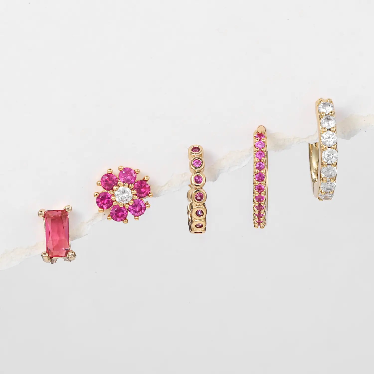 Assorted gold and gemstone earrings in a Women’s Fashion Flower Earrings Set.