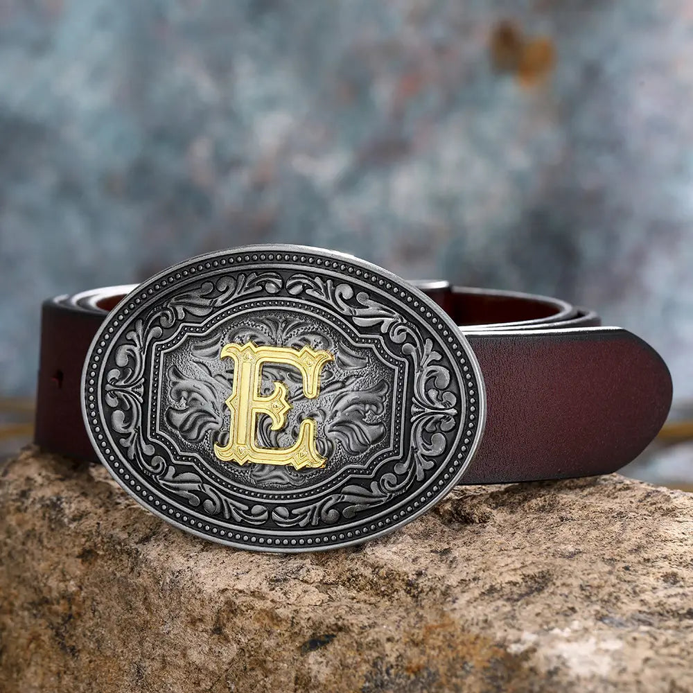 Brown leather belt featuring an ornate silver and gold E buckle in floral design.