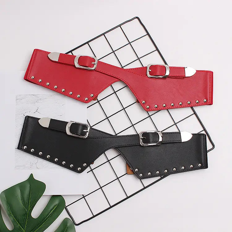 Red and black studded waist belts for women’s decorative dresses and skirts.
