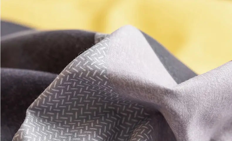 Folded patterned fabric of Washed Cotton Student Hostel Bed Sheets for stylish bedding.